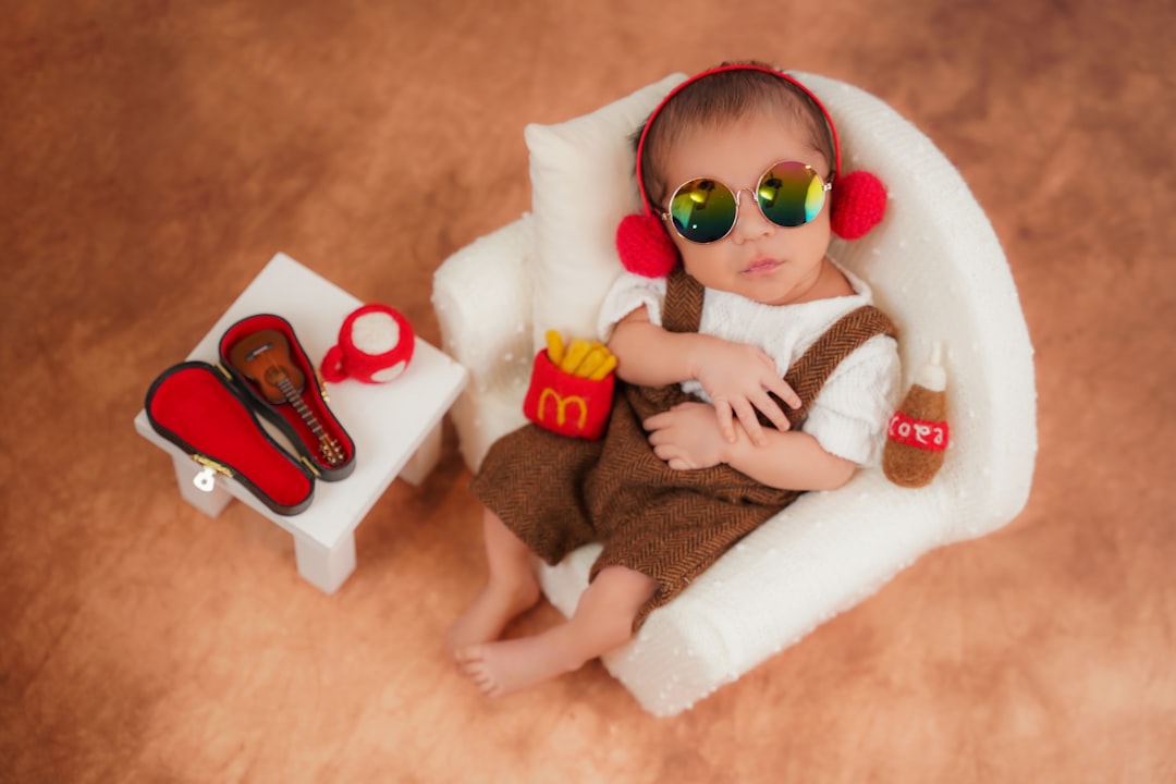 baby-in-sunglasses-and-headphones-with-fast-food-props-1u1qd6jnsam
